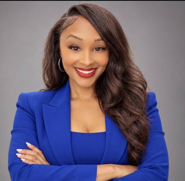 Rachael Waters smiling in a blue blazer